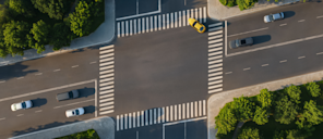 Aerial view of a street intersection where the crosswalks form a slanted parallelogram, imitating the Stripe®澳洲幸运五168体彩开奖官网最新记录 logo.